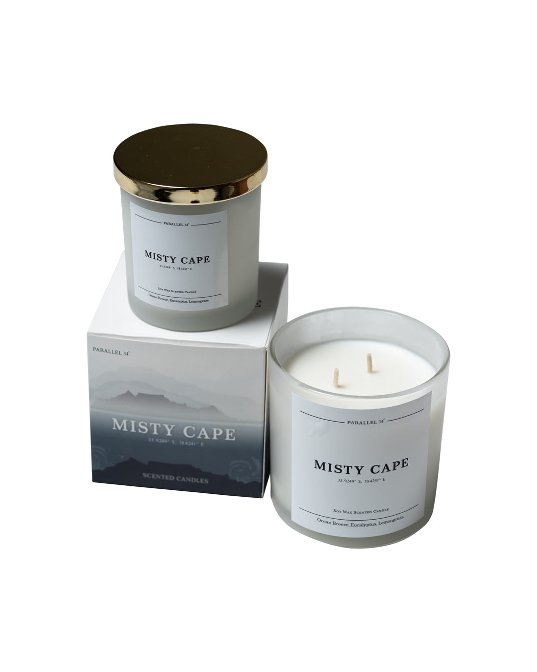 Misty Cape Luxury Scentedcandle with gold lid and matching packaging on a white background